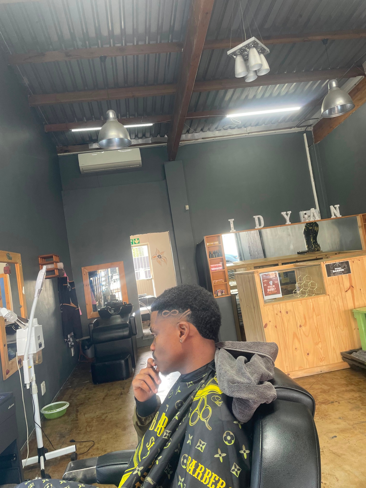 Fade haircut with a freehand crazy line design