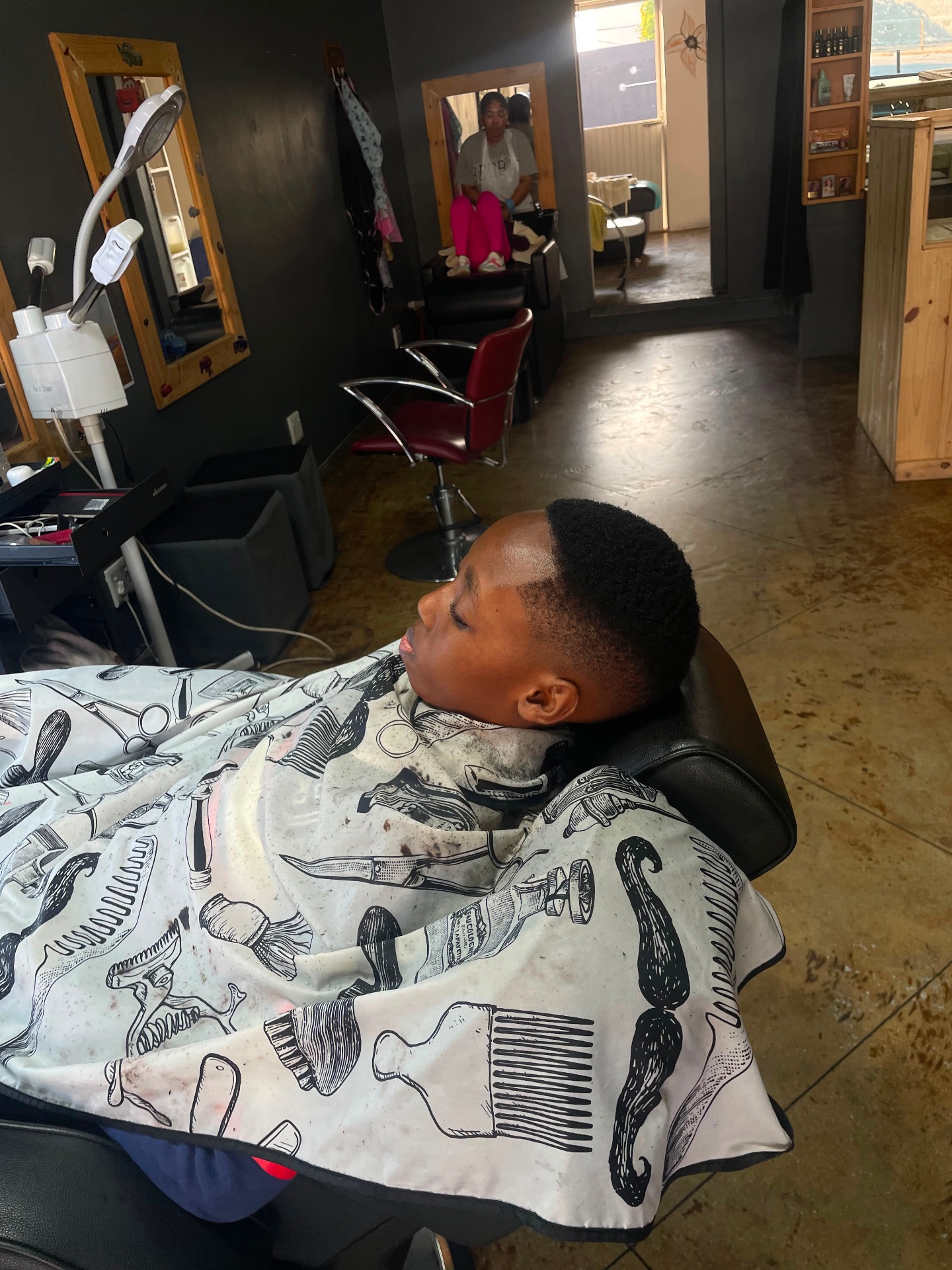 Mid fade haircut in the Idyan Barber chair