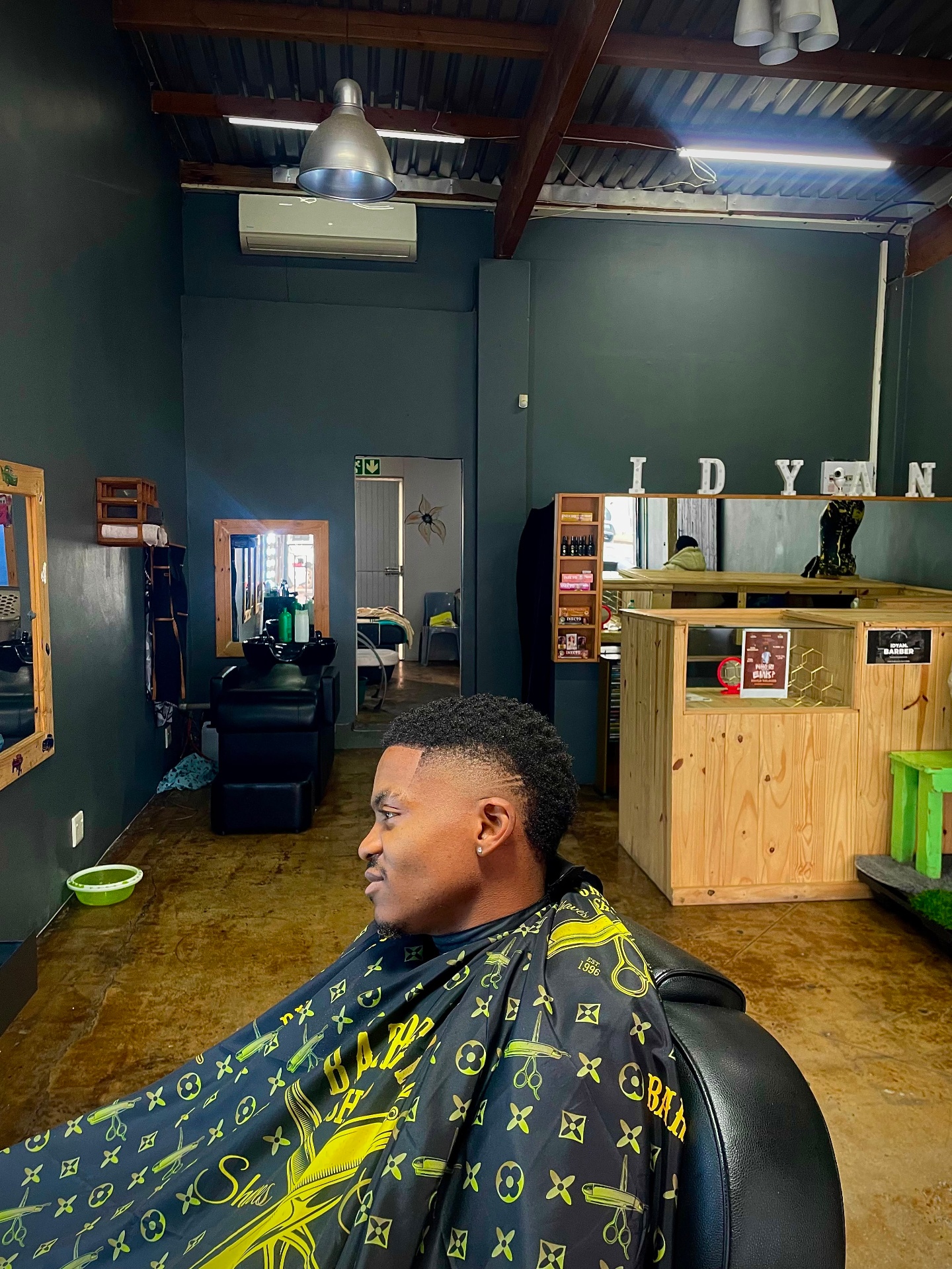 Mohawk haircut with a razor line design
