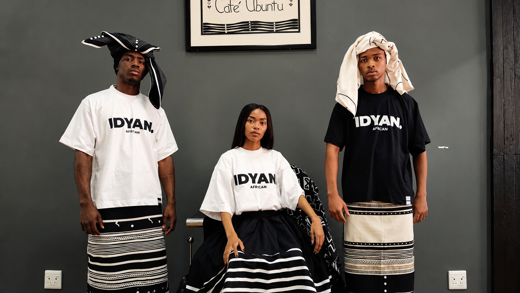 Three people wearing IDYAN. tees with traditional skirts